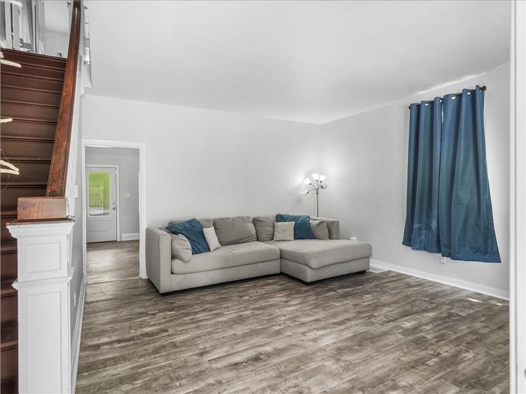 198 Penn Adamsburg Road Penn, PA 15675 - Photo 5 of 27 a living room with furniture and a fireplace