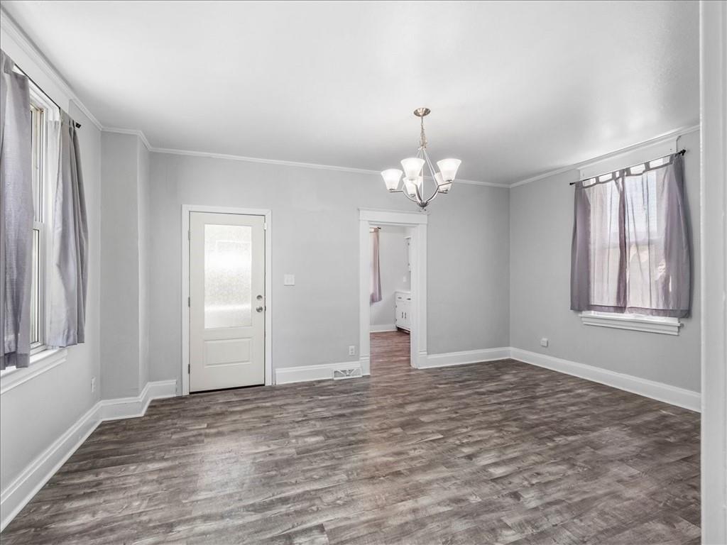 198 Penn Adamsburg Road Penn, PA 15675 - Photo 7 of 27 a view of an empty room with window and wooden floor