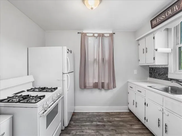 a kitchen with stainless steel appliances a stove and a refrigerator