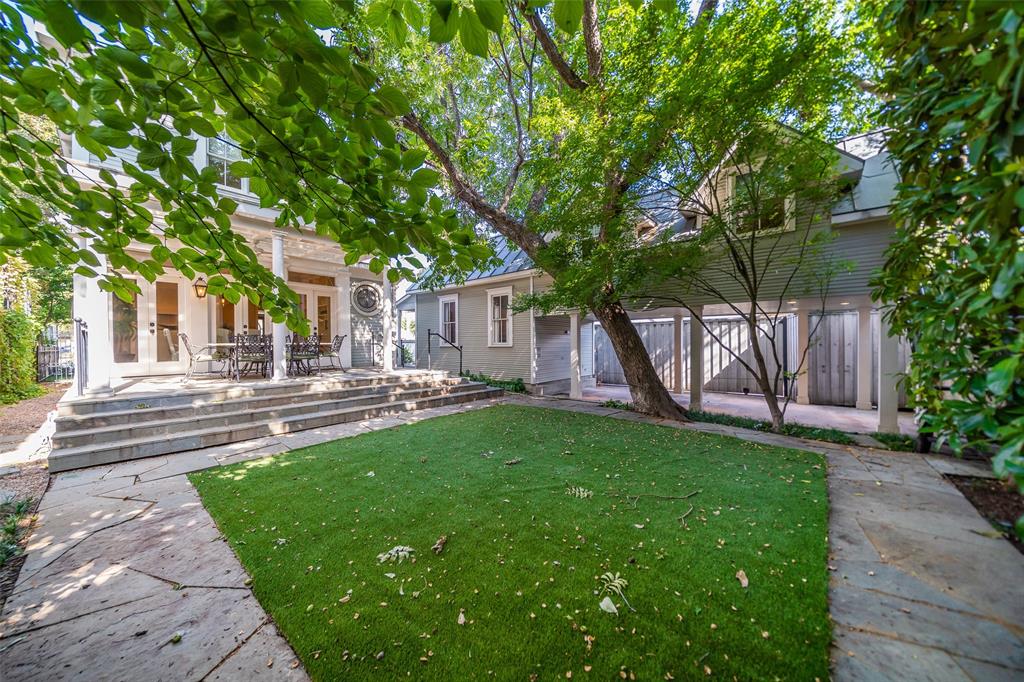 2315 Routh Street Dallas, TX 75201 - Photo 33 of 38 Backyard showing main house and guest house with attached carport and room above