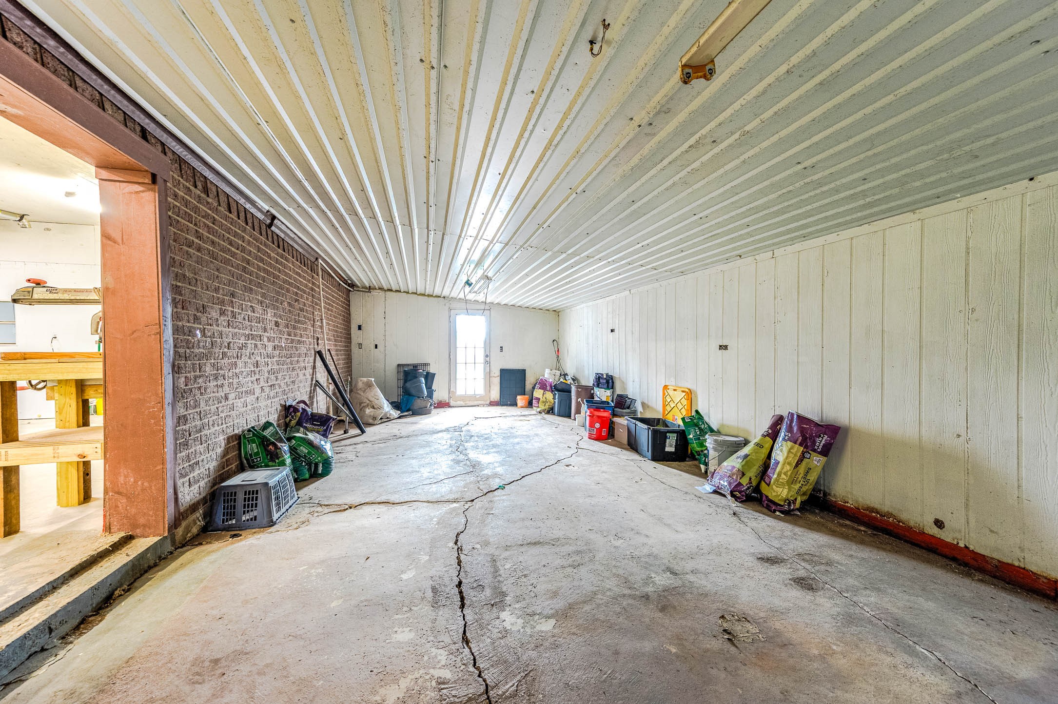 1619 County Road 387 Rosharon, TX 77583 - Photo 34 of 49 Tack room is attached to the workshop and features a separate door for easy backyard access. This room does have electricity and lighting.