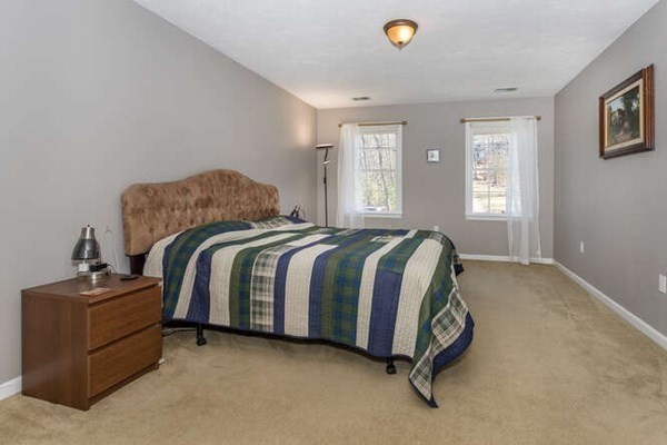 226 Daniels Street Franklin, MA 02038 - Photo 13 of 24 a spacious bedroom with a bed and window
