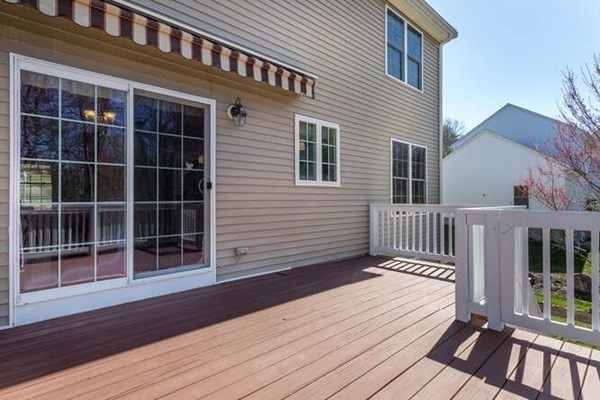 226 Daniels Street Franklin, MA 02038 - Photo 21 of 24 a view of a house with a wooden deck