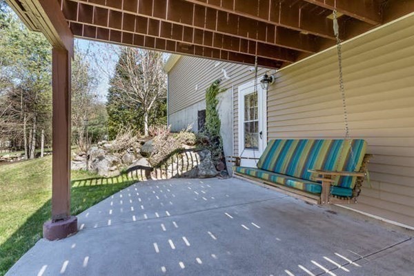 226 Daniels Street Franklin, MA 02038 - Photo 22 of 24 a view of a backyard with a garden and deck