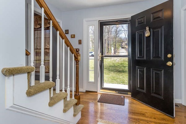 226 Daniels Street Franklin, MA 02038 - Photo 4 of 24 a view of an entryway with wooden floor and door