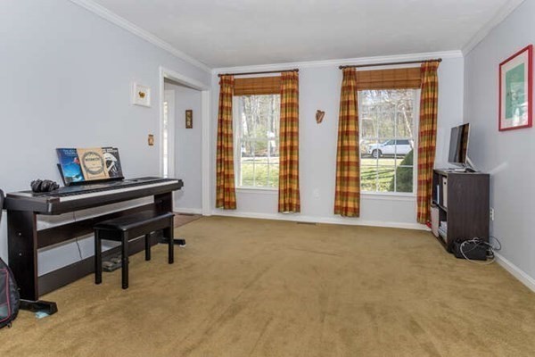 226 Daniels Street Franklin, MA 02038 - Photo 10 of 24 a room with furniture and a window