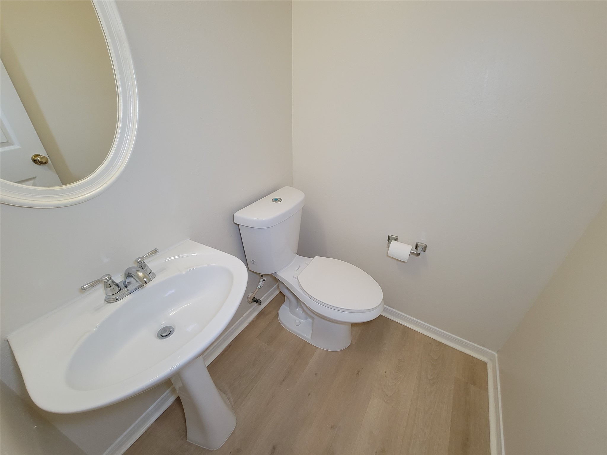 17314 Winfield Square Richmond, TX 77407 - Photo 12 of 47 a white toilet sitting next to a bathroom sink