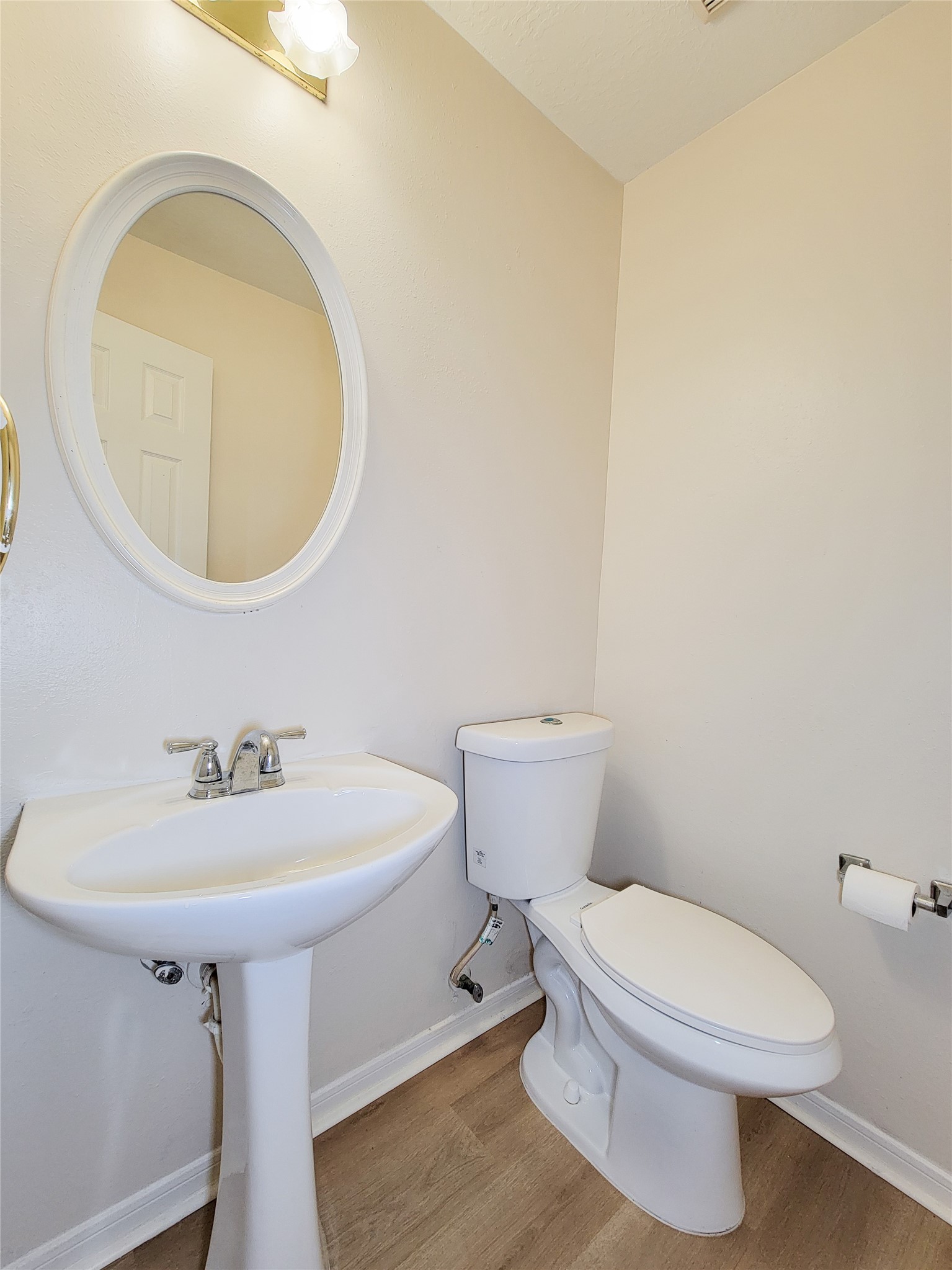 17314 Winfield Square Richmond, TX 77407 - Photo 13 of 47 a white toilet sitting next to a bathroom sink