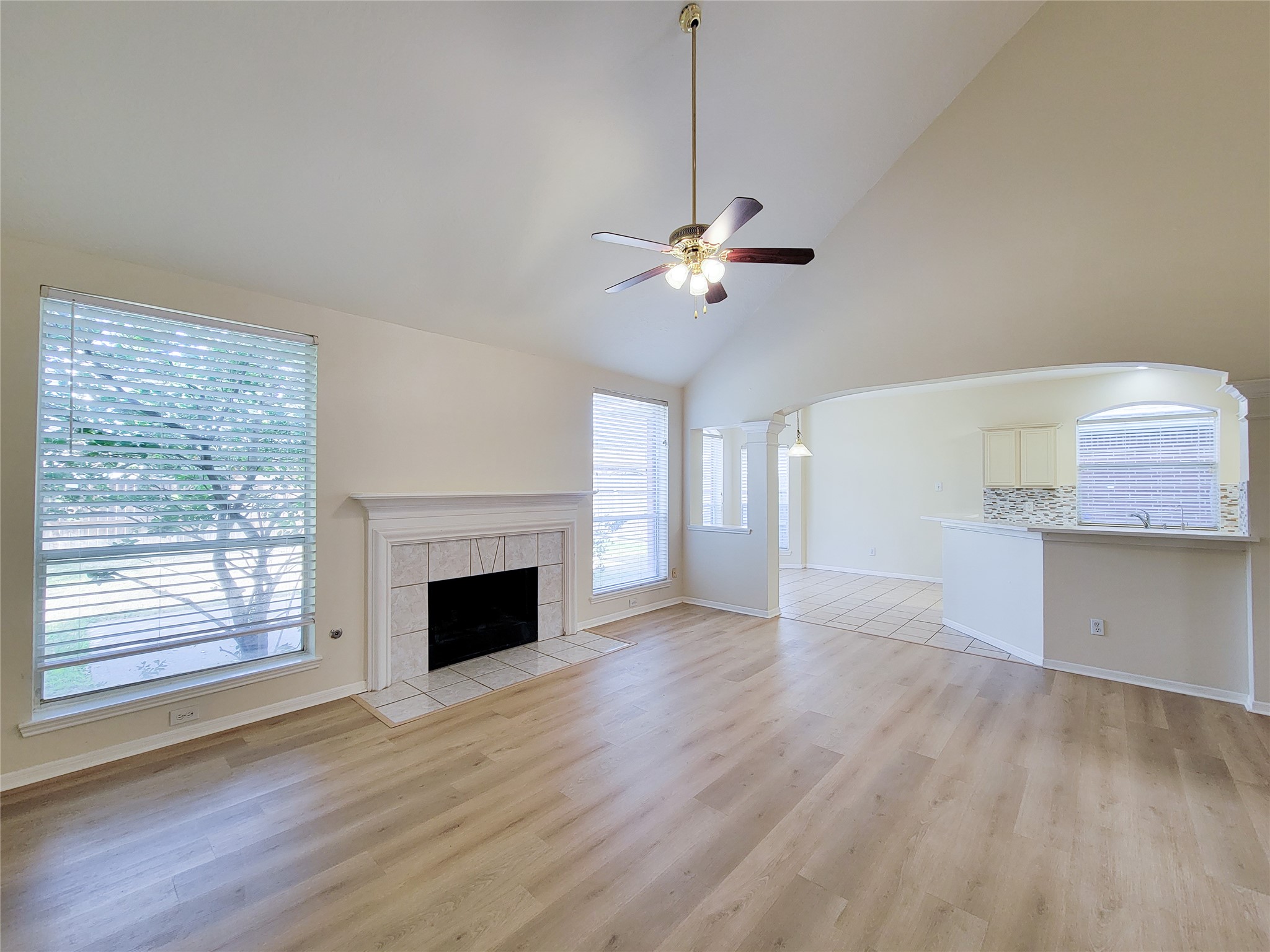 17314 Winfield Square Richmond, TX 77407 - Photo 16 of 47 a view of an empty room with a fireplace and a window
