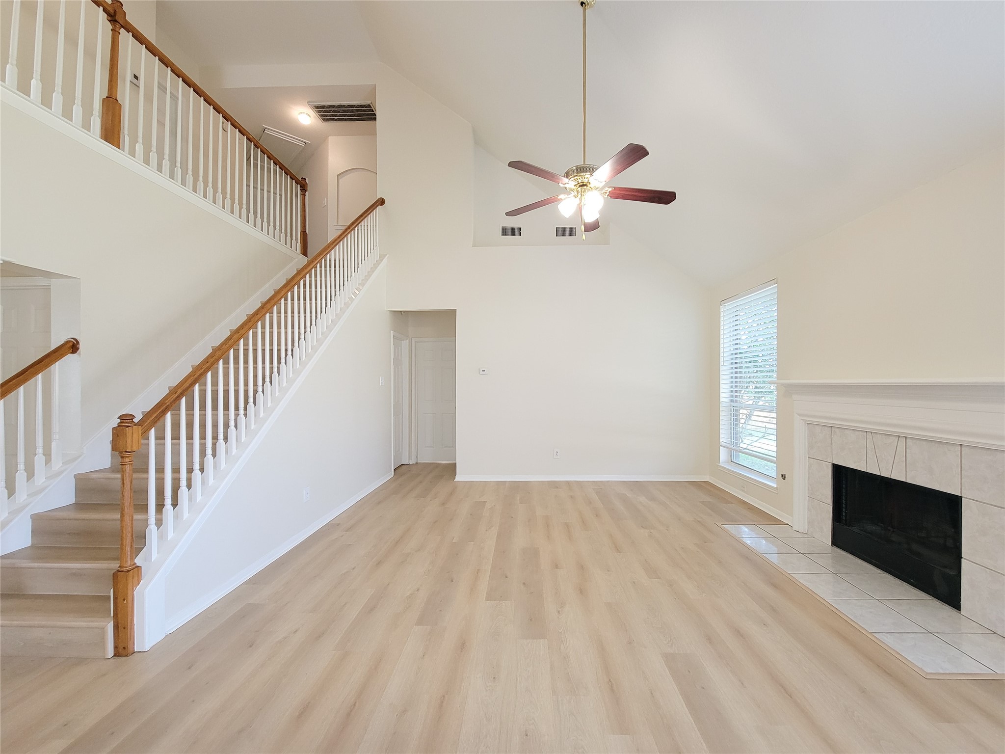 17314 Winfield Square Richmond, TX 77407 - Photo 19 of 47 a view of empty room with wooden floor and ceiling fan