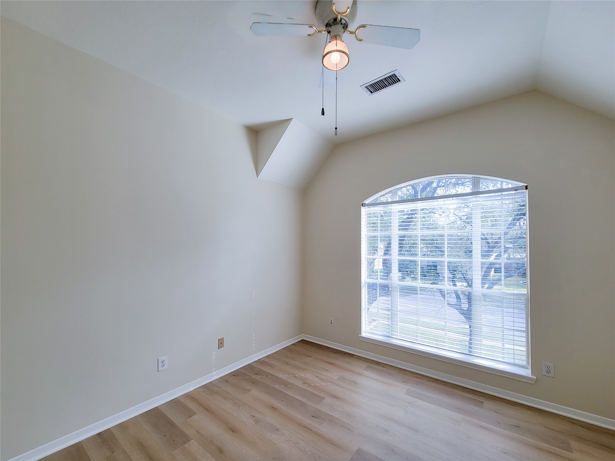 17314 Winfield Square Richmond, TX 77407 - Photo 44 of 47 an empty room with wooden floor and windows