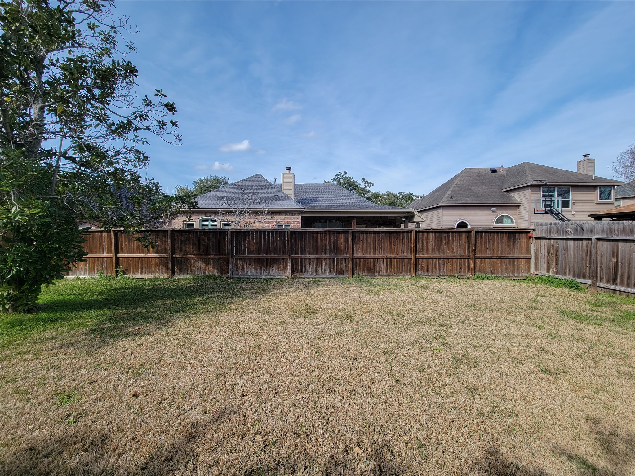 17314 Winfield Square Richmond, TX 77407 - Photo 45 of 47 a view of a house with a yard and sitting area