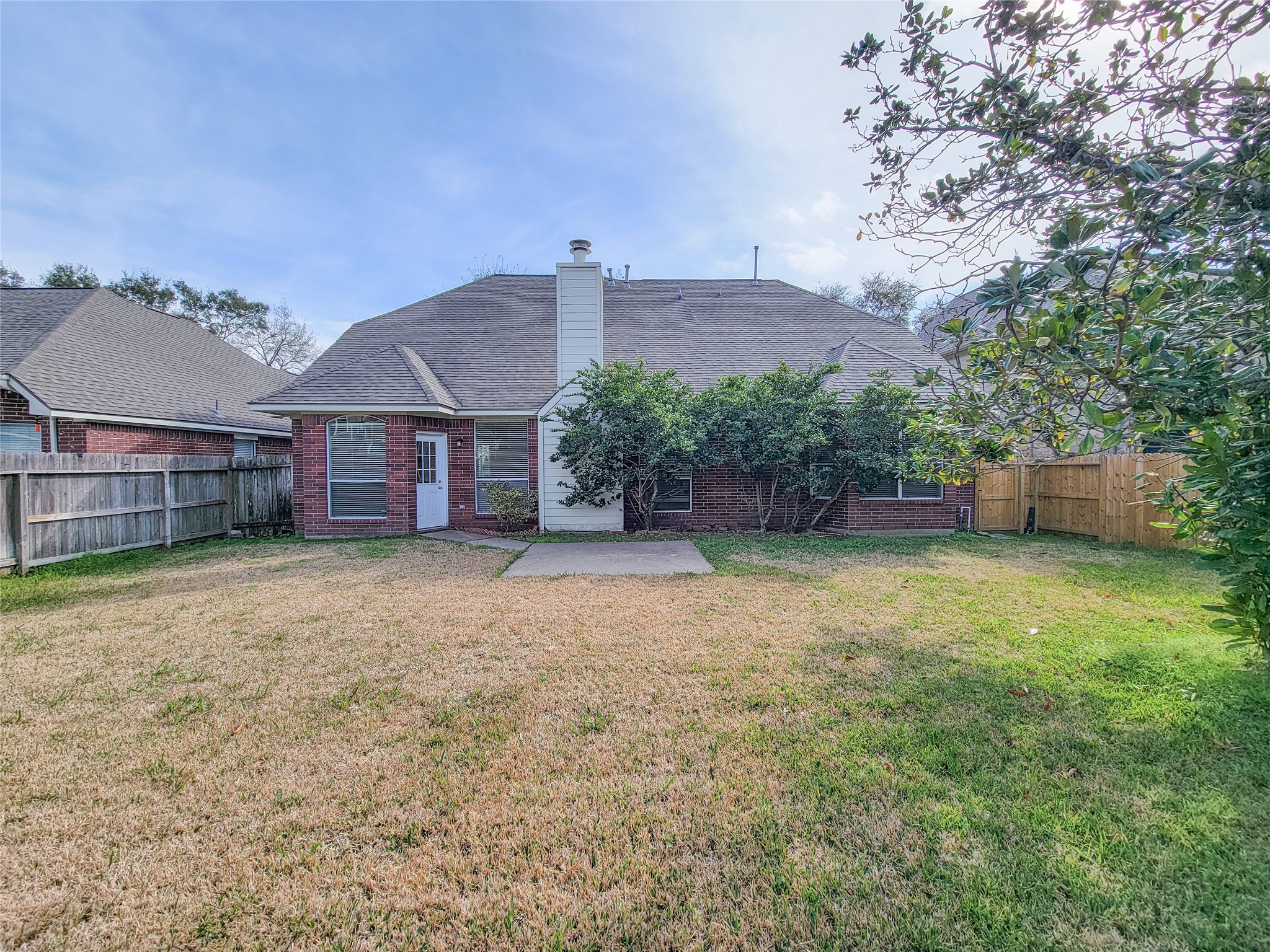 17314 Winfield Square Richmond, TX 77407 - Photo 46 of 47 a view of a house with a yard and a large tree