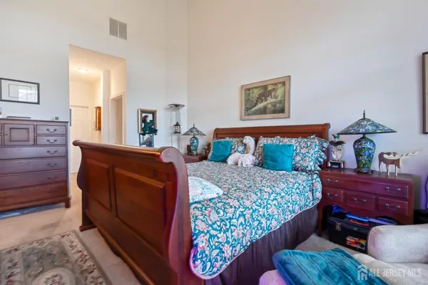 a bedroom with a bed and furniture