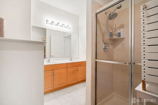 a bathroom with a bathtub and a shower