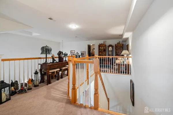 a view of a livingroom with furniture and stairs