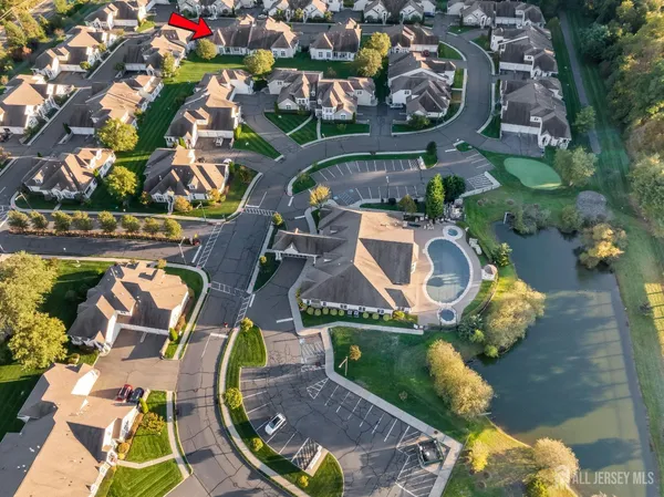 an aerial view of a house with outdoor space swimming pool