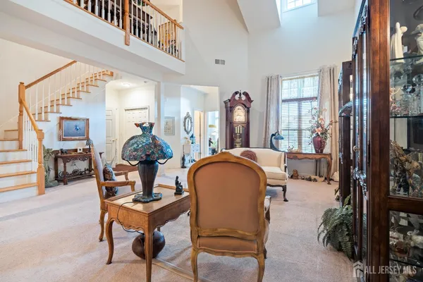 a dining room with furniture and a chandelier