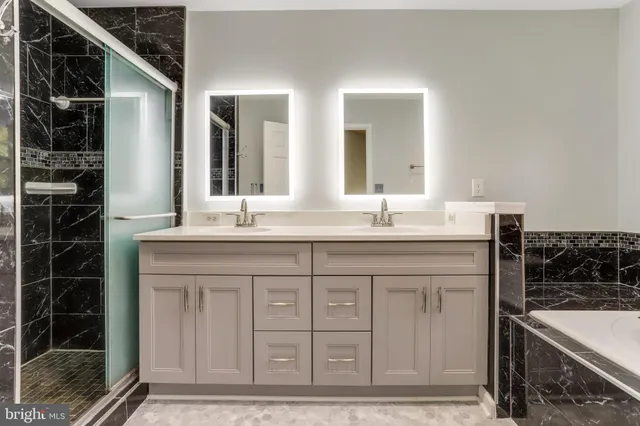 a bathroom with a granite countertop sink a mirror and a