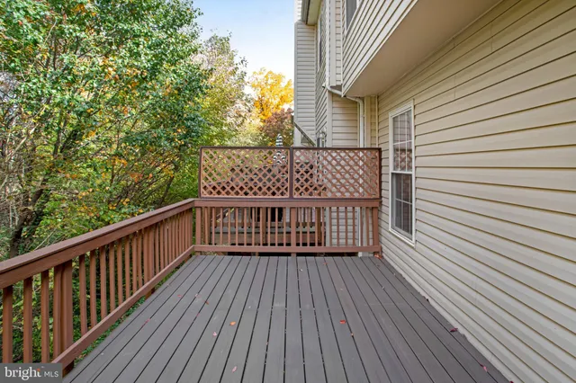 a view of balcony with wooden floor