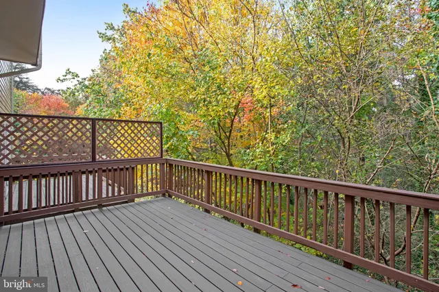 a view of balcony with wooden floor