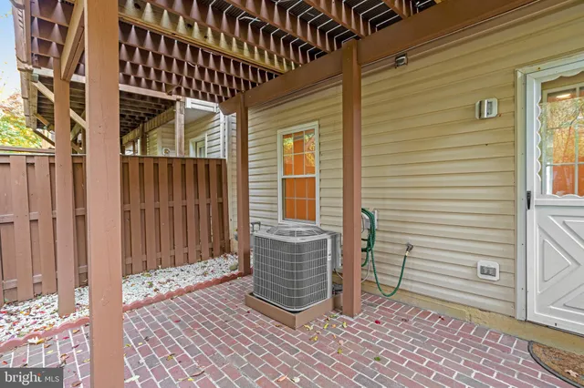 a view of a porch with wooden floor and a yard