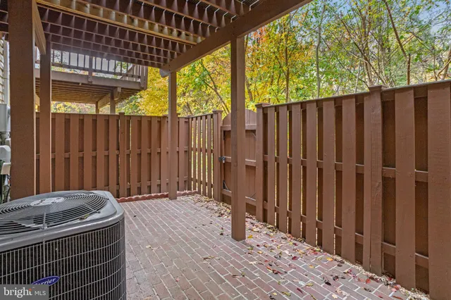 a view of a backyard with wooden fence
