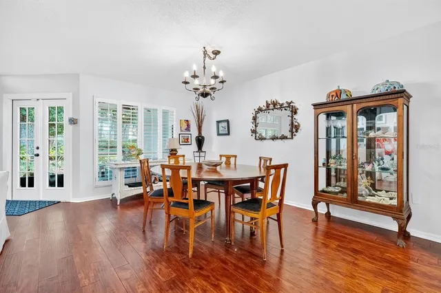 a view of a dining room with furniture window and wooden floor