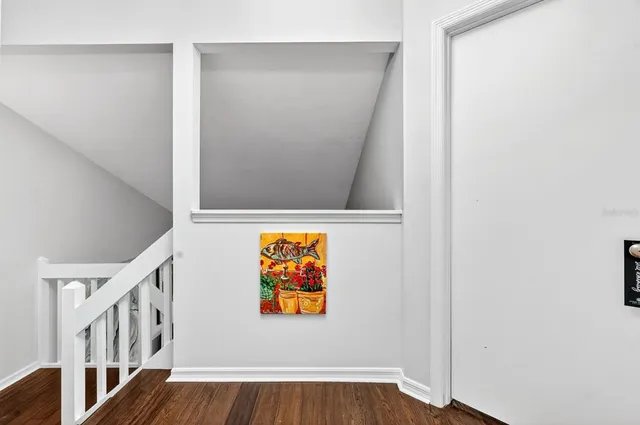 a view of front door with wooden floor