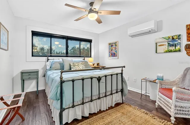 a bedroom with furniture and a window