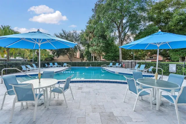 a patio with a patio table and chairs