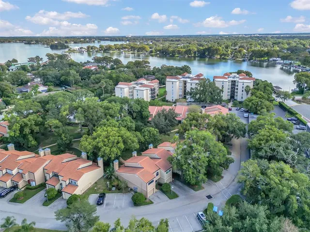 an aerial view of a house with a lake view