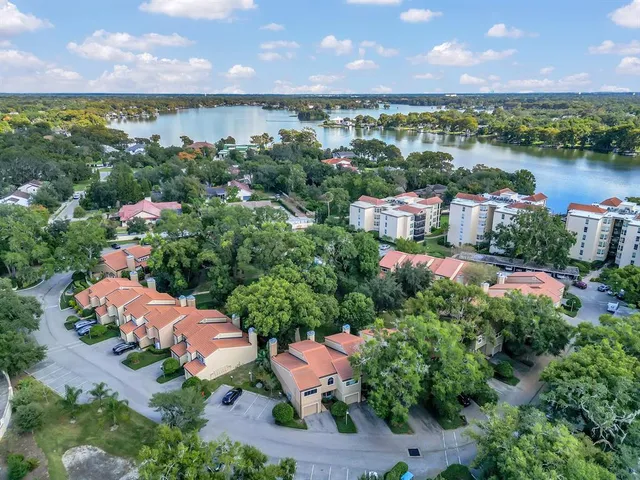 an aerial view of a house with a lake view