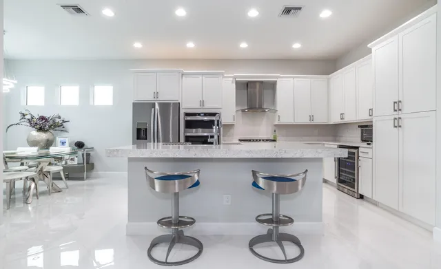 a kitchen with counter top space cabinets and stainless steel appliances
