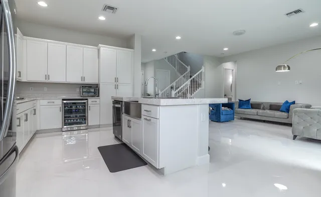 a bathroom with a shower sink and mirror