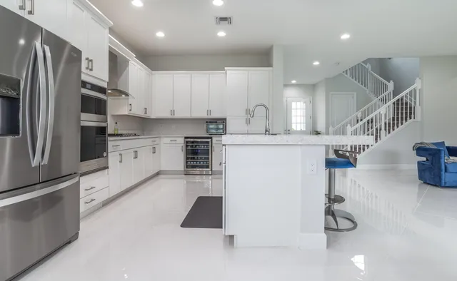 a bathroom with a sink vanity and a mirror