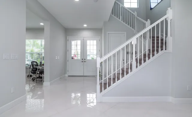a bathroom with a double vanity sink and mirror