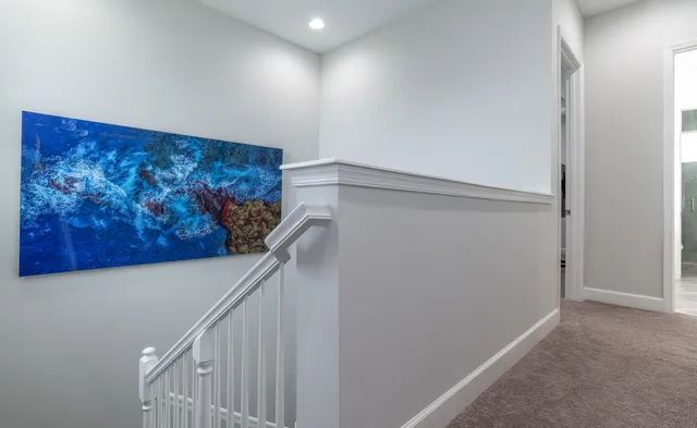 a bedroom with a bed lamp and window