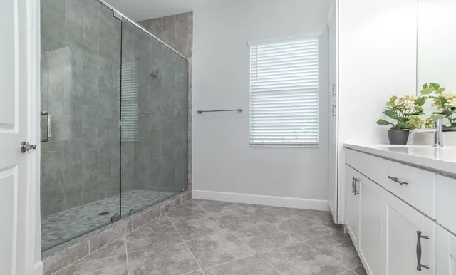 a bedroom with a bed and a table in it