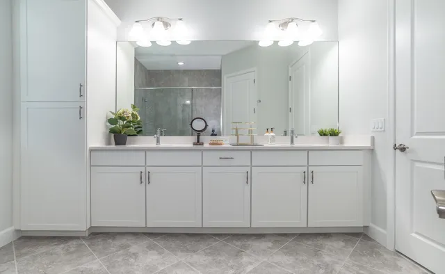 a bathroom with a sink vanity and a mirror