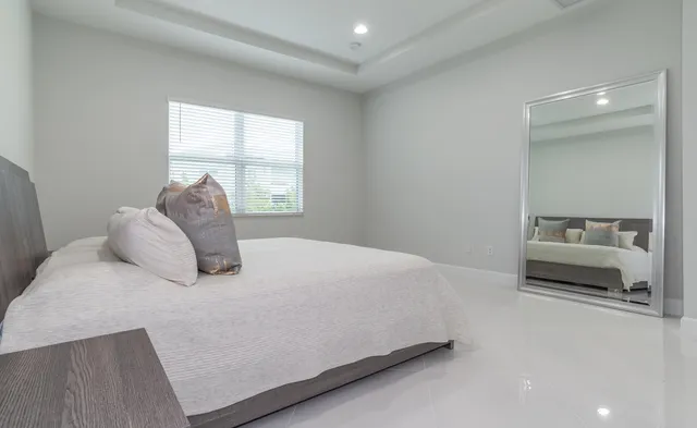 a room with furniture and a floor to ceiling window