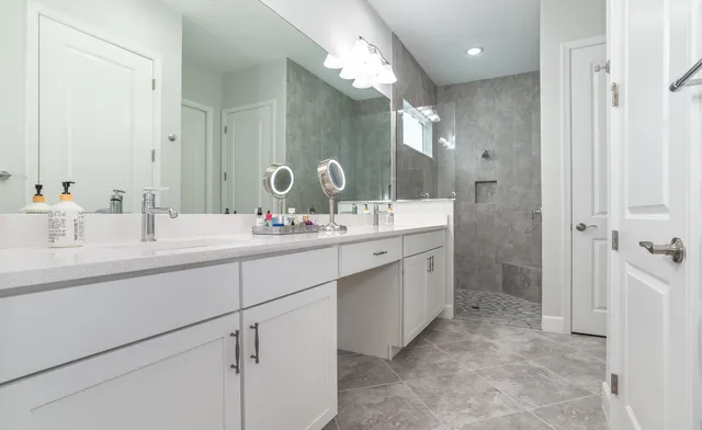 a view of a patio with a table and chairs and potted plants