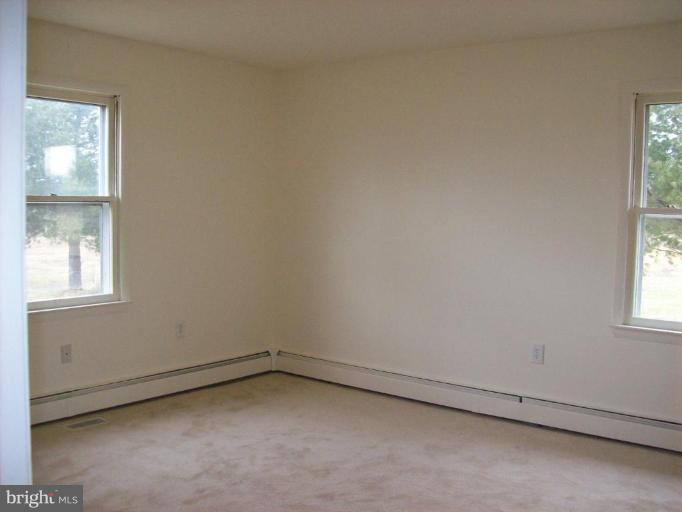 114 Hoofprint Drive Bunker Hill, WV 25413 - Photo 11 of 13 an empty room with a window
