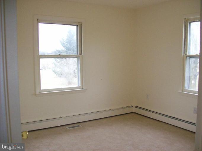 114 Hoofprint Drive Bunker Hill, WV 25413 - Photo 3 of 13 an empty room with a window