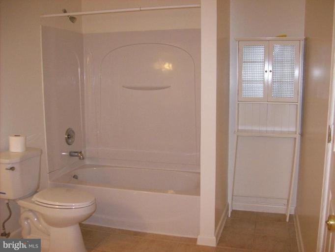 114 Hoofprint Drive Bunker Hill, WV 25413 - Photo 5 of 13 a bathroom with a toilet and a shower