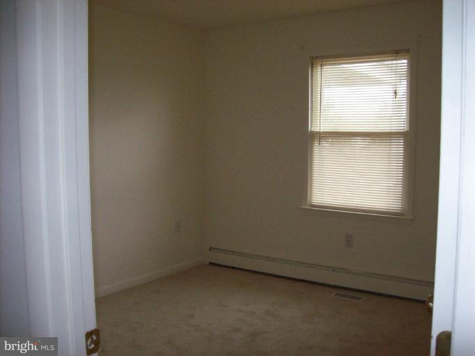 114 Hoofprint Drive Bunker Hill, WV 25413 - Photo 6 of 13 an empty room with a window