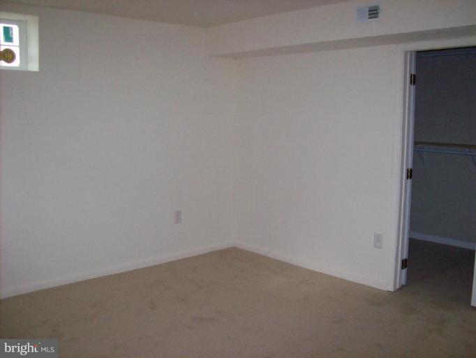 114 Hoofprint Drive Bunker Hill, WV 25413 - Photo 7 of 13 a room that has a window in it