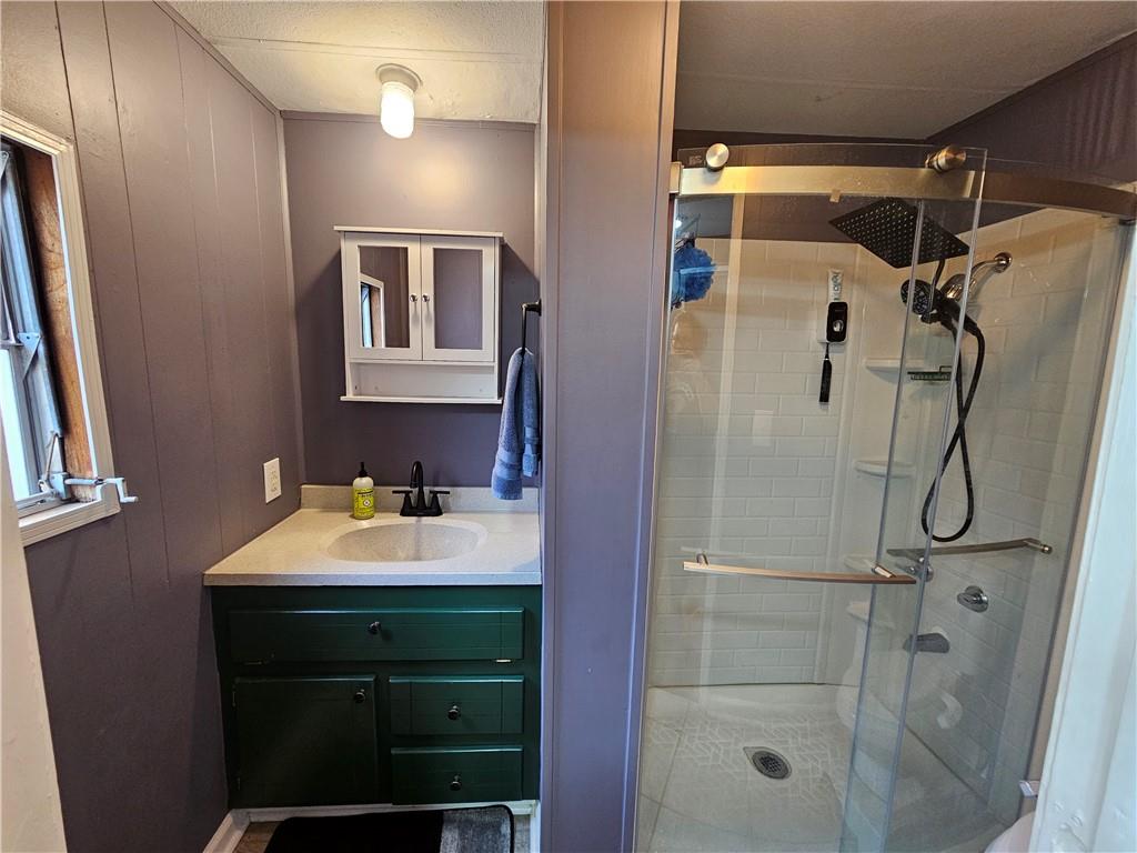 33 Cedar Lane Northwest Rome, GA 30165 - Photo 15 of 22 a bathroom with a sink and mirror