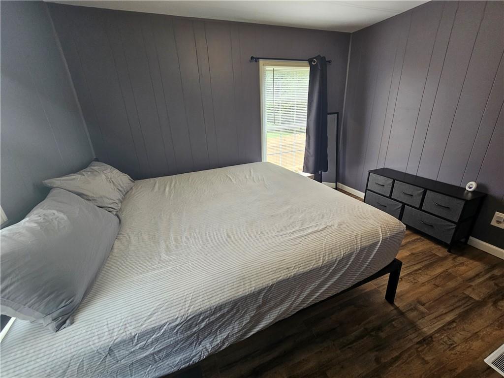 33 Cedar Lane Northwest Rome, GA 30165 - Photo 21 of 22 a bedroom with a bed and a window