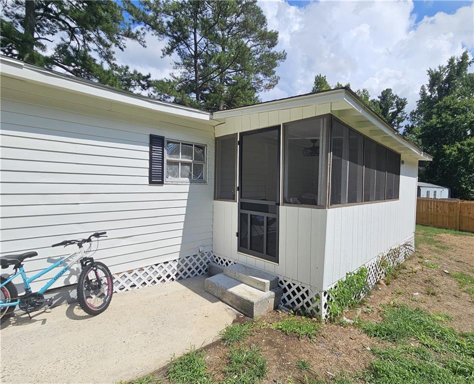 33 Cedar Lane Northwest Rome, GA 30165 - Photo 4 of 22 a view of a wooden house with a small yard